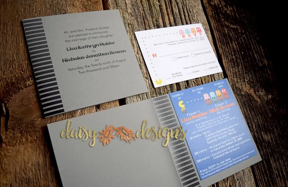 mr. and mrs. pacman wedding invitation and rsvp in a 1980's game cartridge styled tent-fold