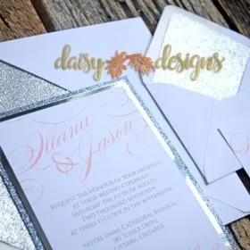 Silver Mirri wedding invitation layered on silver and platinum metallic paper, rsvp and envelopes with metallic liners