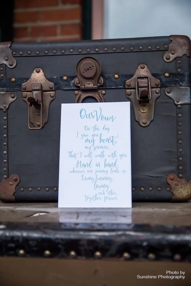 Printed vows resting on old trunk