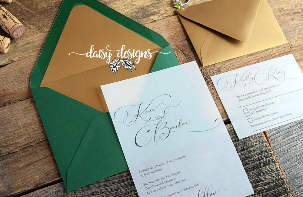 Simply Sophia invite on vellum with green envelope and gold liner and gold rsvp envelope