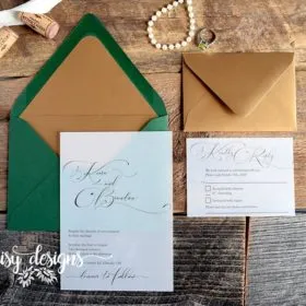 Simply Sophia invite on vellum with green envelope and gold liner and gold rsvp envelope