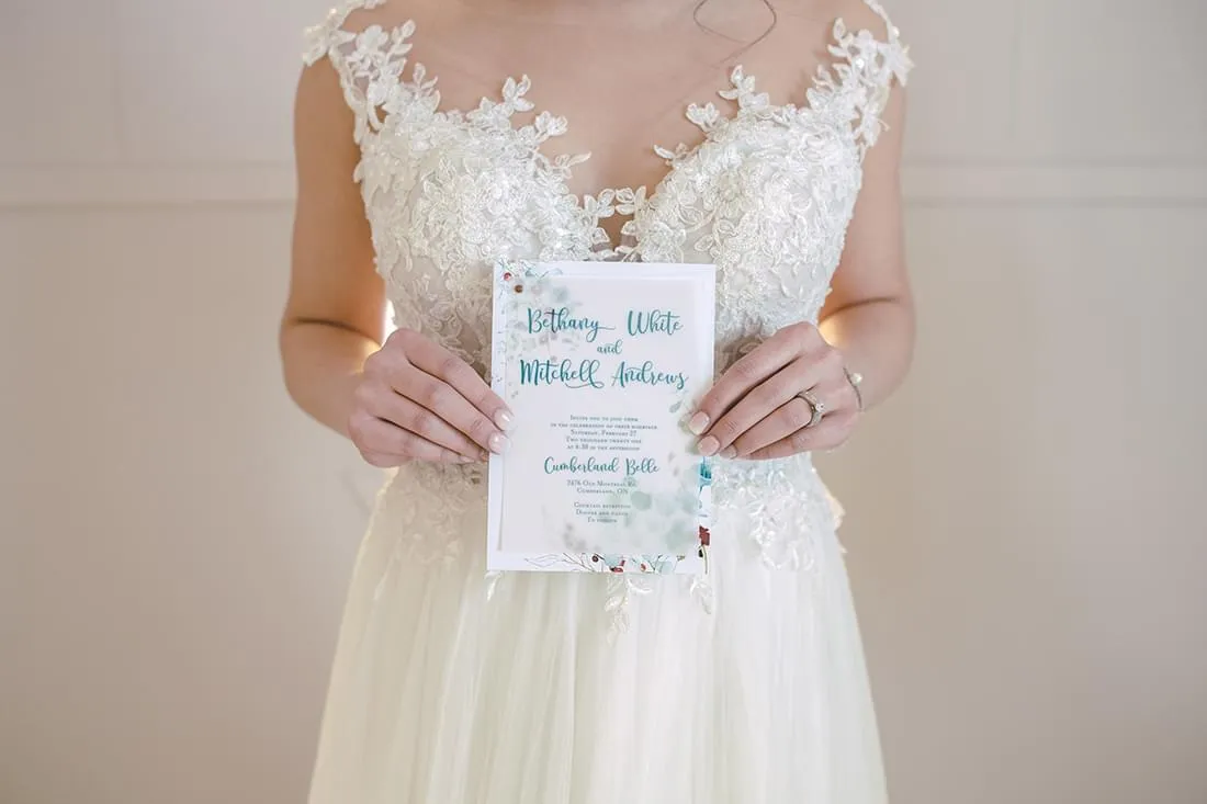 Cumberland Belle invite held by bride