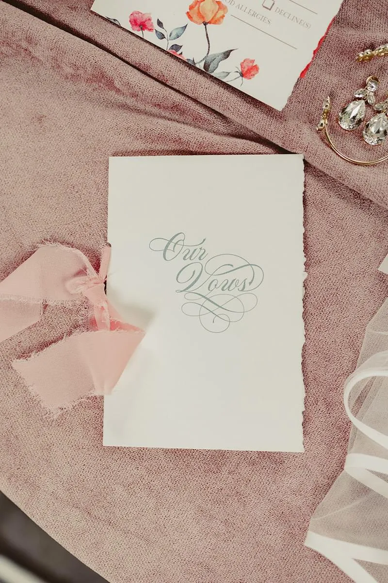 Our Vows with torn edge and ribbon