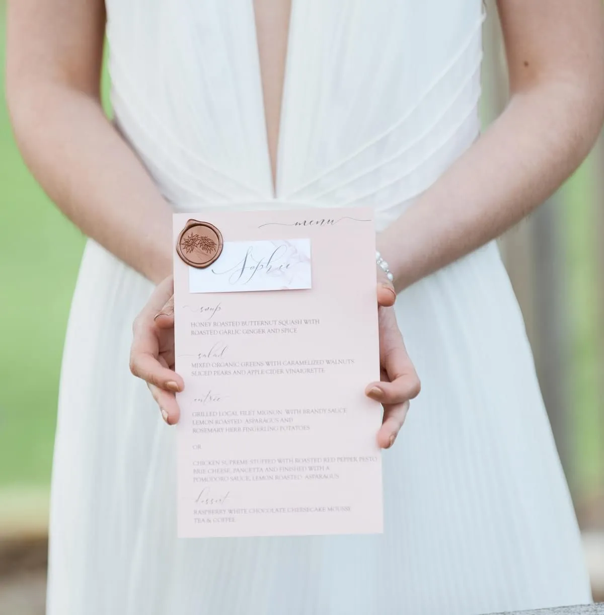 Peach menu with place card and wax seal